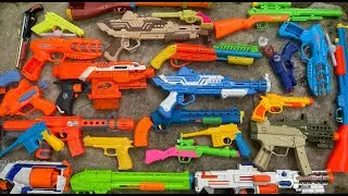 Box of Toy Guns. AK47 Rifles Toys, Metallic Tec 9 Gun, Exploding Weapons, Sharp Karambin Knives