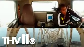Dash cam captures semi-truck dangling off bridge after crash
