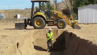 Digging a Trench with the Front Bucket By Operator Robinson