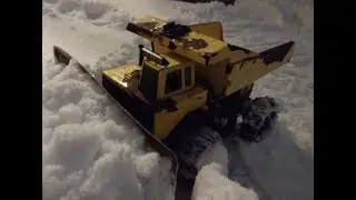 RC Tonka snow plow truck plowing driveways.