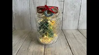 Christmas trees, fairy lights and snow in a glass bottle from Dollar Tree!