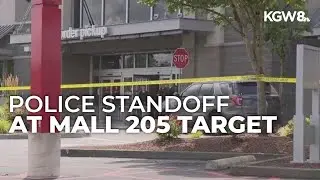 Police officers block entrance to Target store at Mall 205