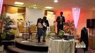A girl is giving  her money box - Yemen Crisis Fundraising Dinner   Saturday   16th May 2015