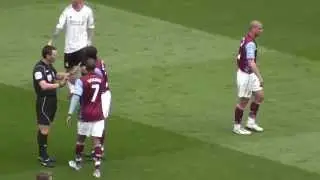 Luke Young (AVFC) with a crunching tackle on Dirk Kuyt (LFC) [Villa v Pool, 2011]