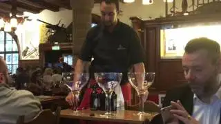 Zeughauskeller waiter mixing a flaming beer drink!