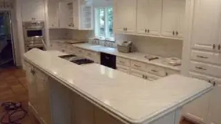 Honed Carrera Marble Kitchen with Laminated Island