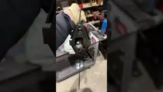 Volkswagen Bay window bus maintenance Tap installing shift rod with adjuster plate.
