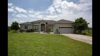 REMARKABLE EXECUTIVE STYLE HOME situated on nearly ONE and a HALF ACRES!