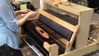 Bucky Lab weaving on a 8 shaft table loom