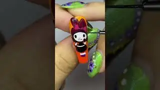 hello kitty halloween nail inspo using color changing gels