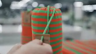 Cutting, Sewing & Packaging of Green Petition Beach Towels