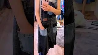 Repurposed utility dark gray denim apron with blue pockets. Sold.