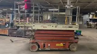 Snorkel, model SL25, 850 capacity, 24V electric scissor lift | Lot 10990 | Orbitbid