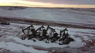 Aerial view of Pumping Units & Watford City Sunrise