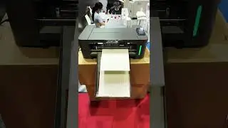 Cosmox UV film cutting machine, automatically cut after print.