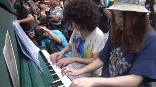 Nancy Loo and Ivana Wong playing a street piano.