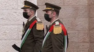 Macron greeted by Palestinian President Mahmoud Abbas in Ramallah