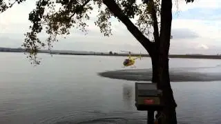 Helicopter Flying Low Over Water