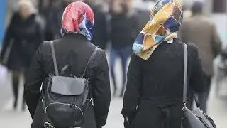 Employers can ban workers from wearing headscarves or religious symbols, ECJ rules