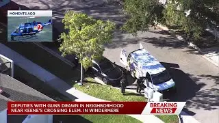 Deputies have guns drawn in Windermere neighborhood