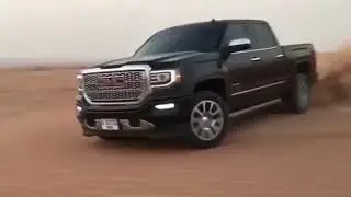Tvhit GMC in the desert .