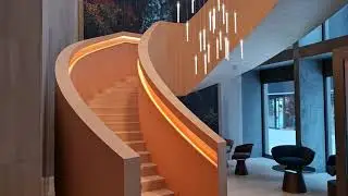 Wir haben einer Stahltreppe ein Holzkleid gebogen.