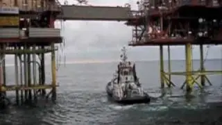 Ensco 92 jack up rig anchor and cable are taken under the Murdoch platform bridge