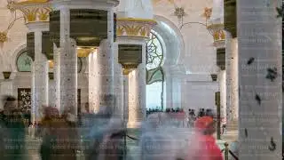 Magnificent interior of Sheikh Zayed Grand Mosque timelapse with crowd in Abu Dhabi.
