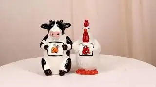 Ebros Holstein Cow and Hen Holding Steak & Roast Chicken Sign Salt Pepper Shakers Set
