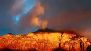 zion sun rise light breaking through the clouds as birds serenade dawn