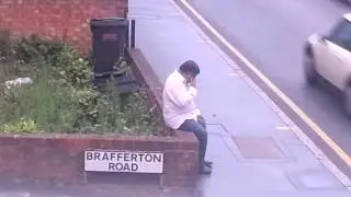 Drunk guy falls over wall