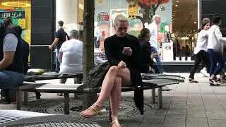 Blonde woman candid smoking cigarette