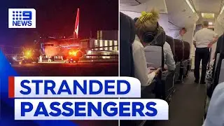 Furious Qantas passengers stranded on runway for hours | 9 News Australia