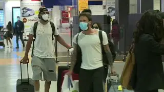 Travelers return to Fiumicino airport in Rome | AFP