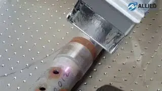 Robot Arm Laser Cleaning a Metal Pipe