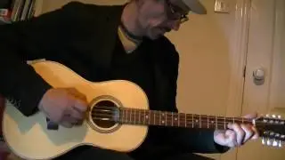 Paul Hathway's amazing fantastic hybrid parlour guitar with short-scale bouzouki neck.