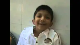A young kid talks with his doctor using Hearing Aid