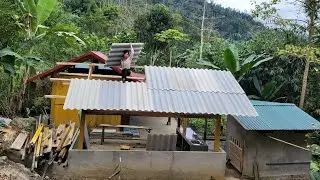 Linh built a sturdy and durable roof for the kitchen using cement roofing sheets.