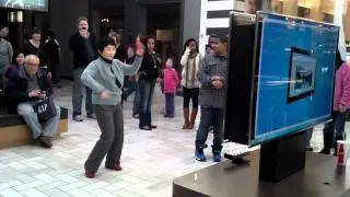 Asian Lady playing DDR Kinect for Xbox360