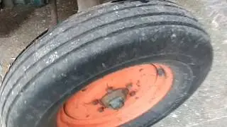 Filling tires with water or slime on a tractor. Tube or valve stem type tires.
