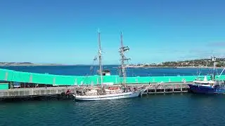 DJI mini 3 pro ,One and All sail boat tying up at Port Lincoln wharf