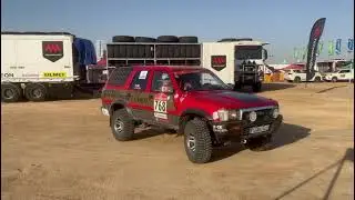 Dakar 2026 - Yanbu - Andy in racing car - mosaic designed by Red Andy Art