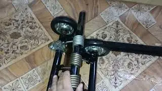 Slide suspension for a motorized towing vehicle