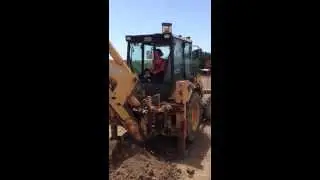 Learning how to drive a backhoe