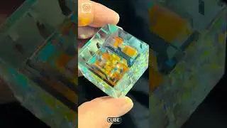 This cold worked dichroic glass and optically clear starfire glass cube