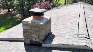 Roof leak inspection at the chimney flashing