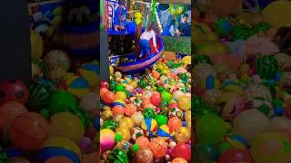 The boy minion shirt wait for the girls go up from the purple slide ball house ride exciting #fun