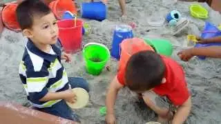 Kids play in the sand box Silver Bear Preschool