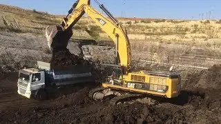 Caterpillar 385CLME Excavator Loading Coal On Trucks