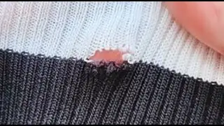 Repairing a sweater with a sewing needle and a hook for lifting loops